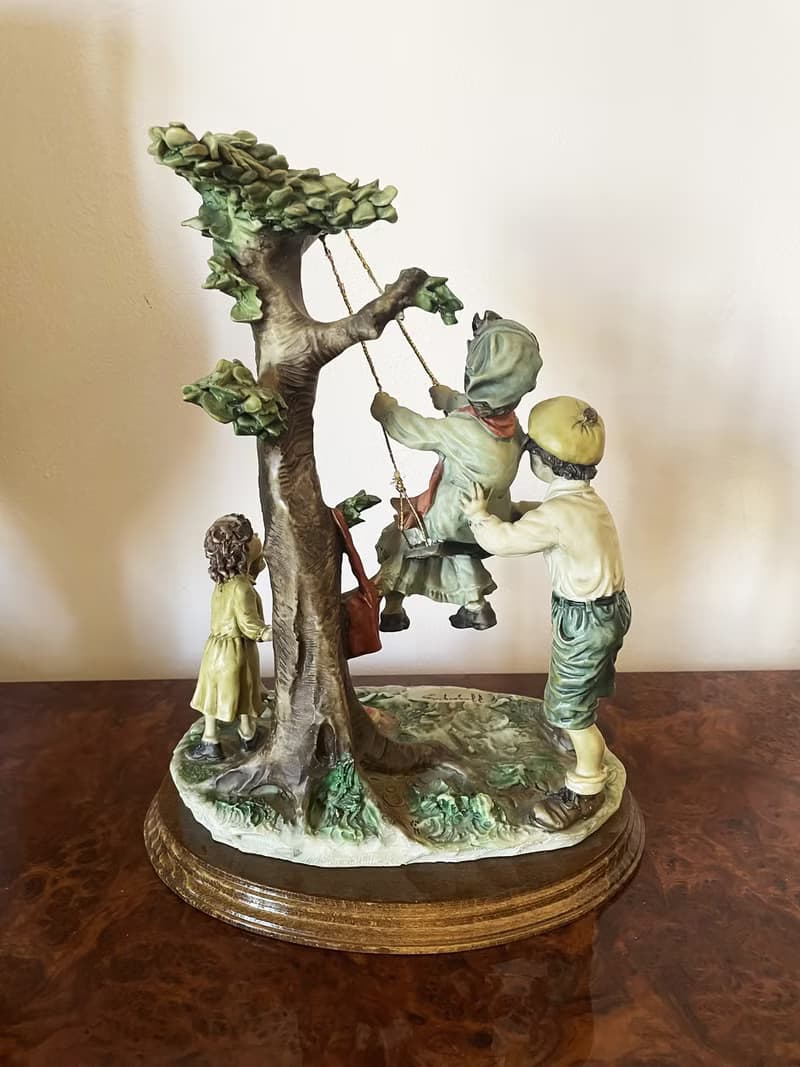 Capodimonte – Large sculpture of children on a swing