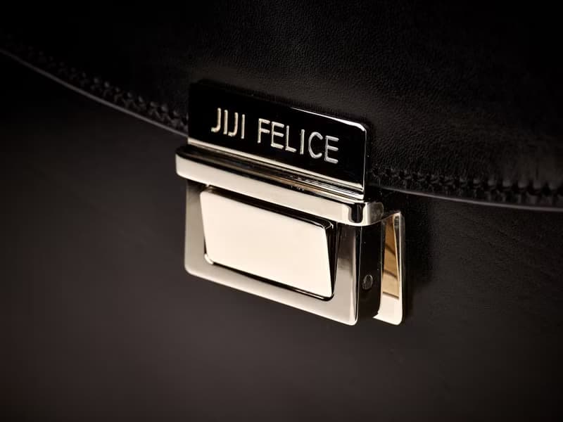Black vegetable-tanned leather briefcase / nickel finish brass accessories