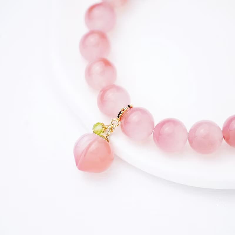 聚寶半盆 蜜桃果汁鹽源瑪瑙彈性手鍊