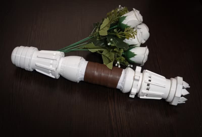 White wedding bouquet holder inspired by Rey's lightsaber hilt