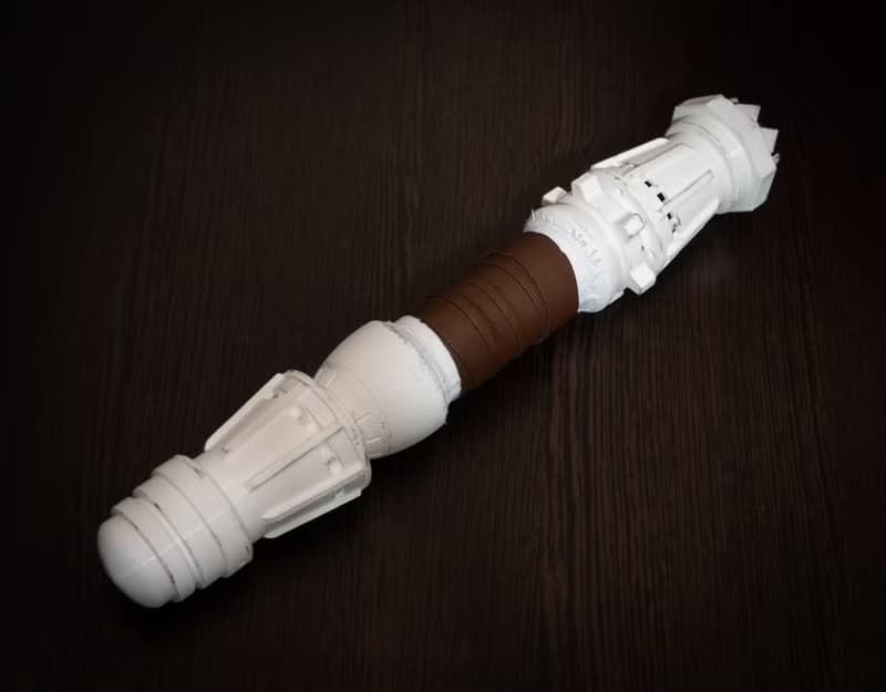 White wedding bouquet holder inspired by Rey's lightsaber hilt