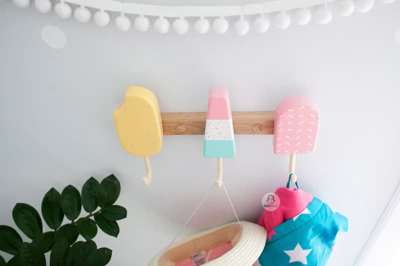Clothes and towel hanger for nursery with wooden ice cream hooks