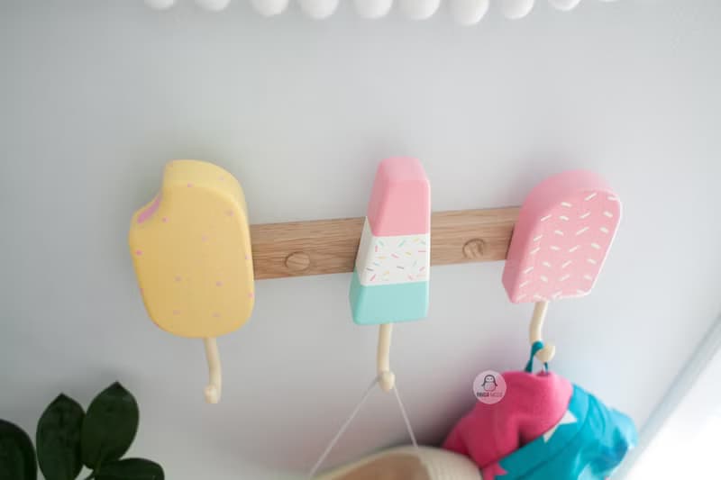 Clothes and towel hanger for nursery with wooden ice cream hooks