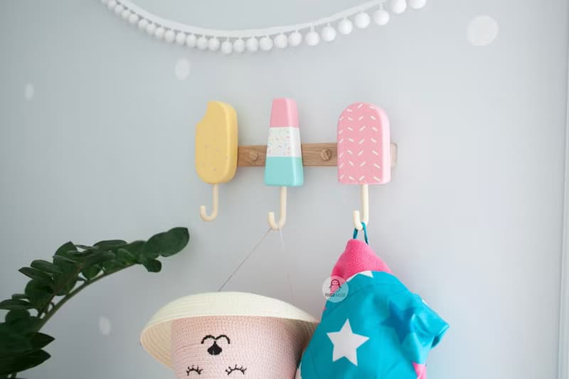 Clothes and towel hanger for nursery with wooden ice cream hooks