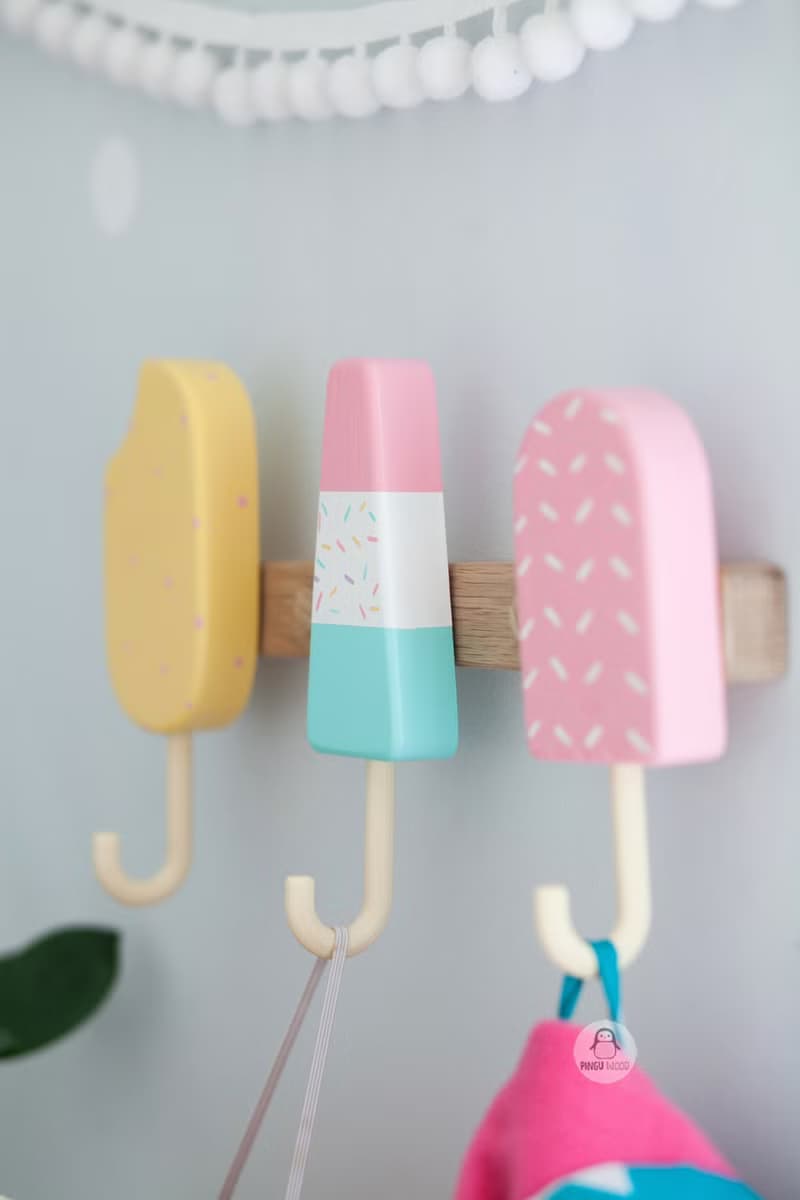 Clothes and towel hanger for nursery with wooden ice cream hooks