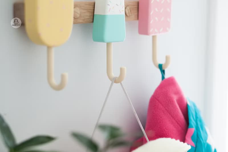 Clothes and towel hanger for nursery with wooden ice cream hooks