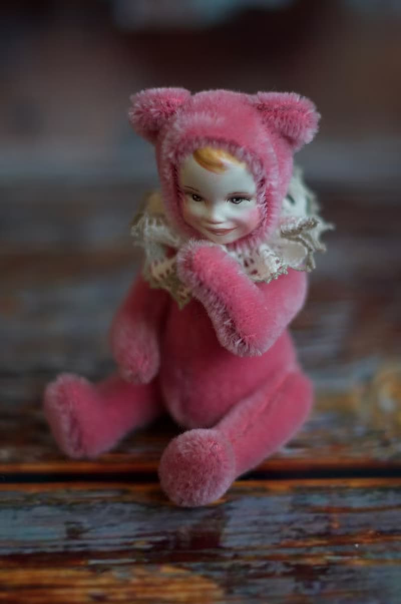 Raspberry teddy doll created with pink mohair with hand painted face