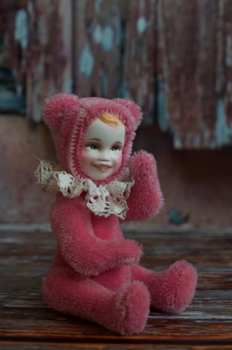 Raspberry teddy doll created with pink mohair with hand painted face