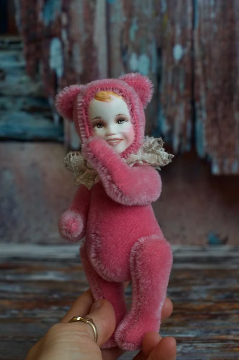 Raspberry teddy doll created with pink mohair with hand painted face