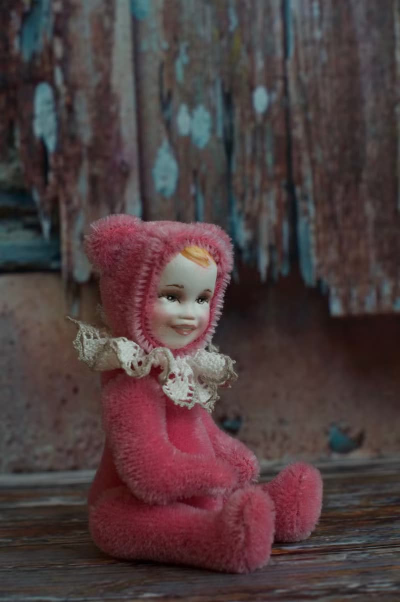 Raspberry teddy doll created with pink mohair with hand painted face