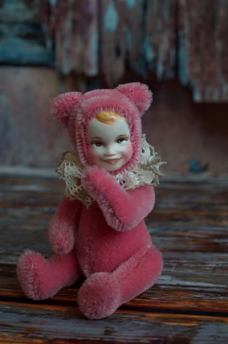 Raspberry teddy doll created with pink mohair with hand painted face