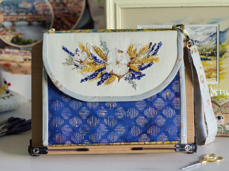 Handmade needles-and-tools organizer with hand cross stitched bouquet