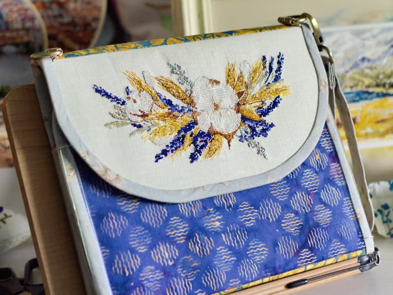 Handmade needles-and-tools organizer with hand cross stitched bouquet