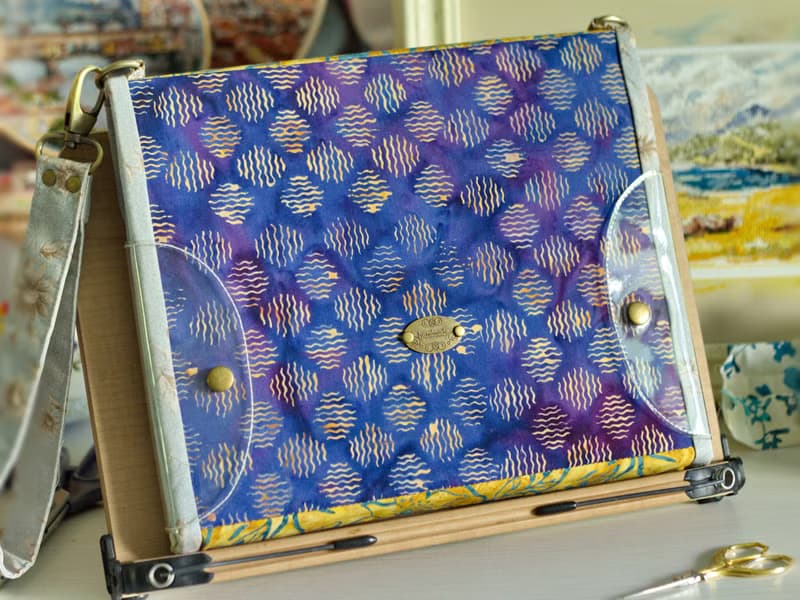 Handmade needles-and-tools organizer with hand cross stitched bouquet