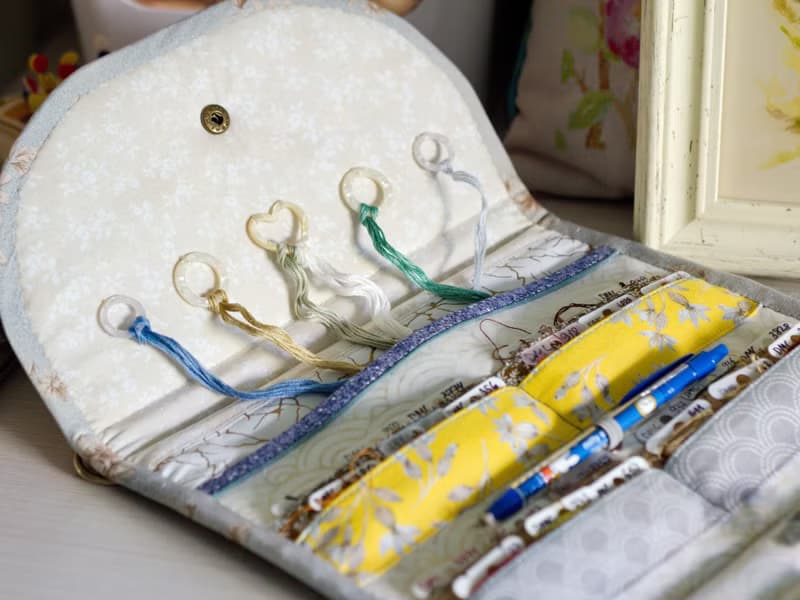 Handmade needles-and-tools organizer with hand cross stitched bouquet