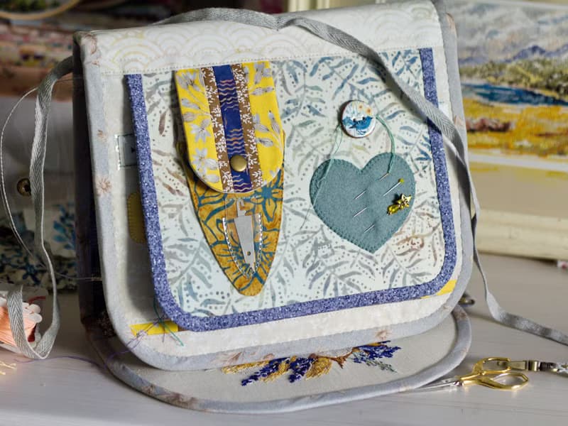 Handmade needles-and-tools organizer with hand cross stitched bouquet