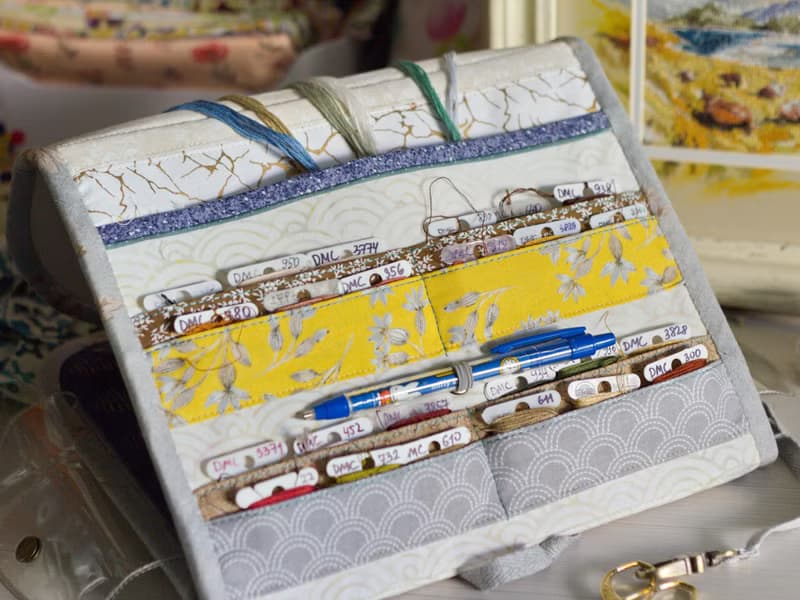 Handmade needles-and-tools organizer with hand cross stitched bouquet