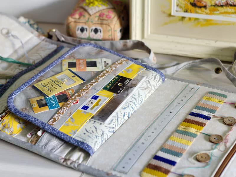 Handmade needles-and-tools organizer with hand cross stitched bouquet