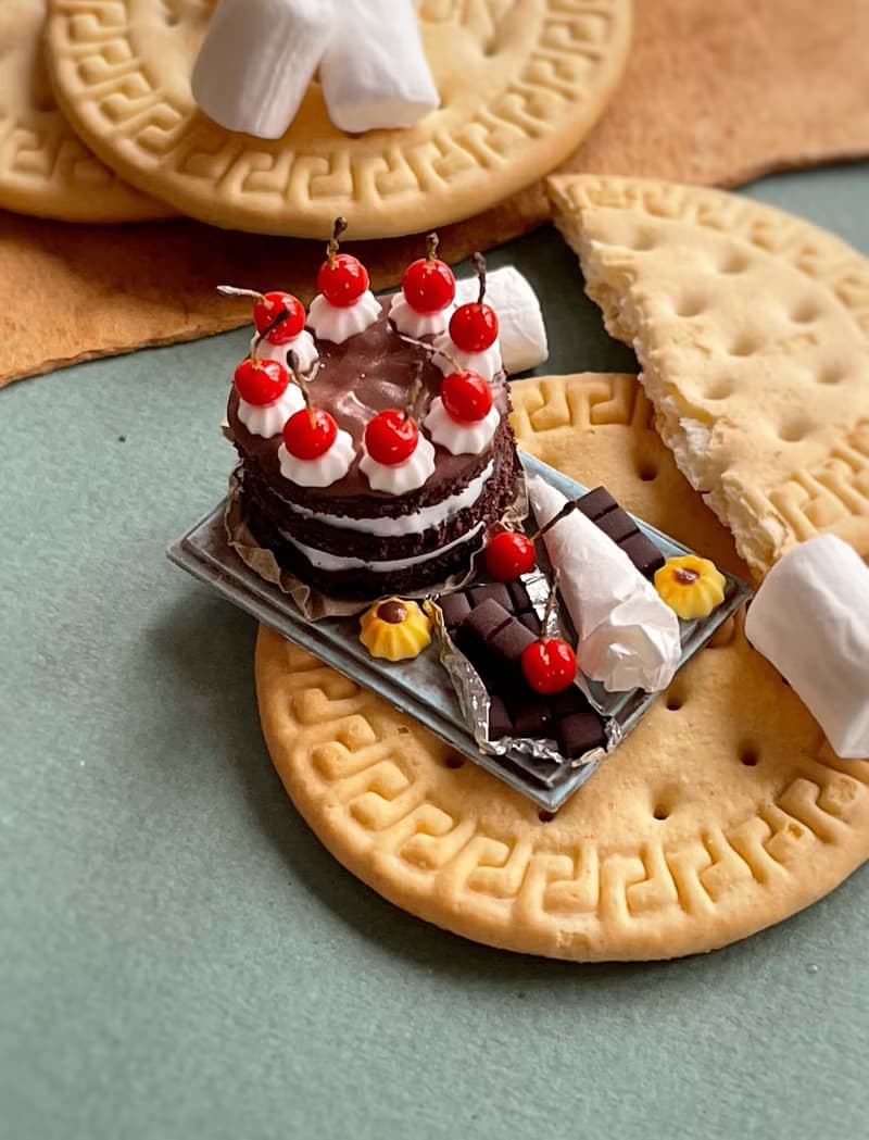 Miniature chocolate cake set with cherries