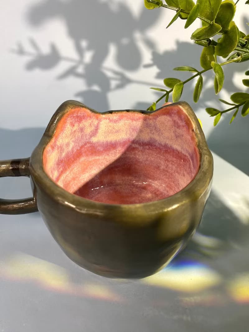 Handmade ceramic cup. Handmade ceramic mug with cute cat and flower lover for gifts.