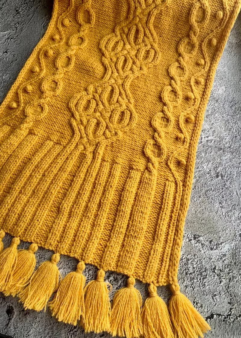 Handmade mustard scarf with beautiful pattern and tassels knitted from merino