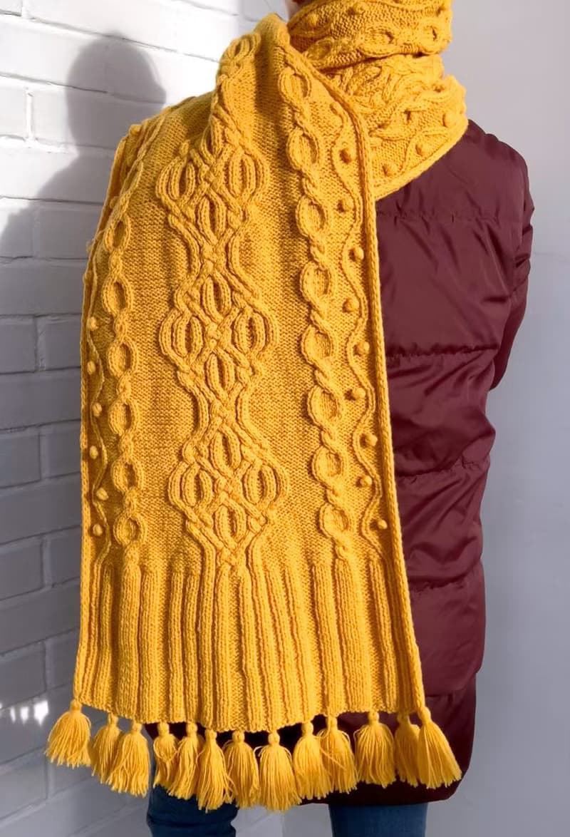 Handmade mustard scarf with beautiful pattern and tassels knitted from merino