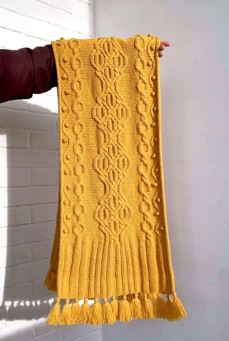 Handmade mustard scarf with beautiful pattern and tassels knitted from merino