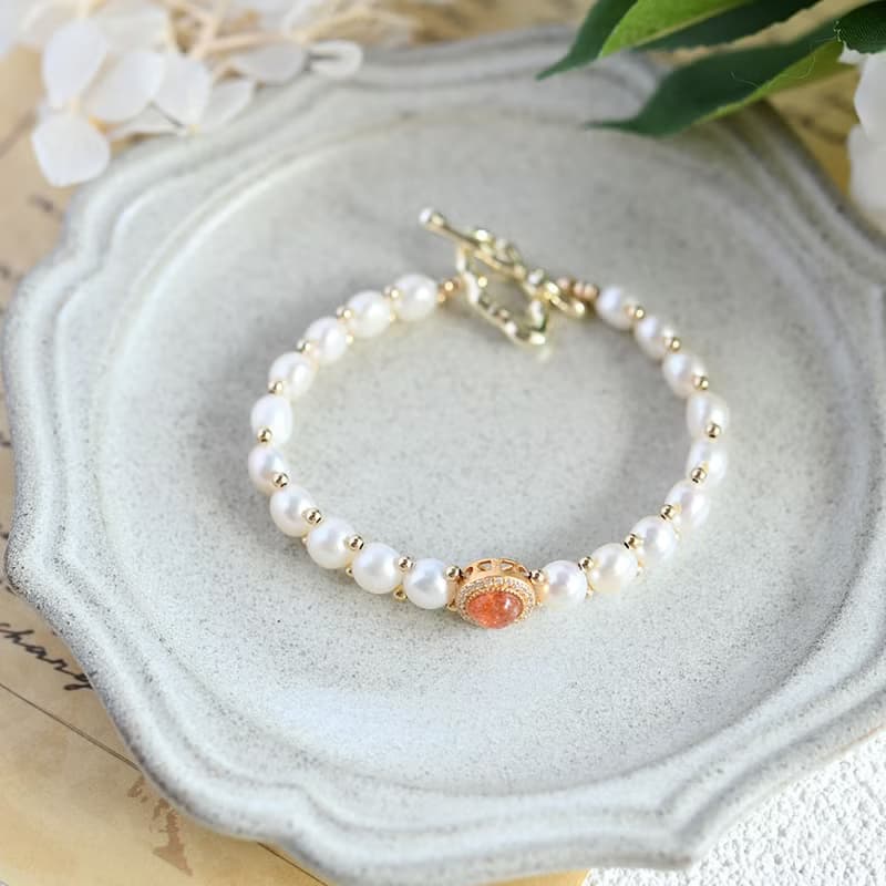 成功へと導いてくれる　キスミー　サンストーンとバロックパールの手編みブレスレット 5月/6月誕生石