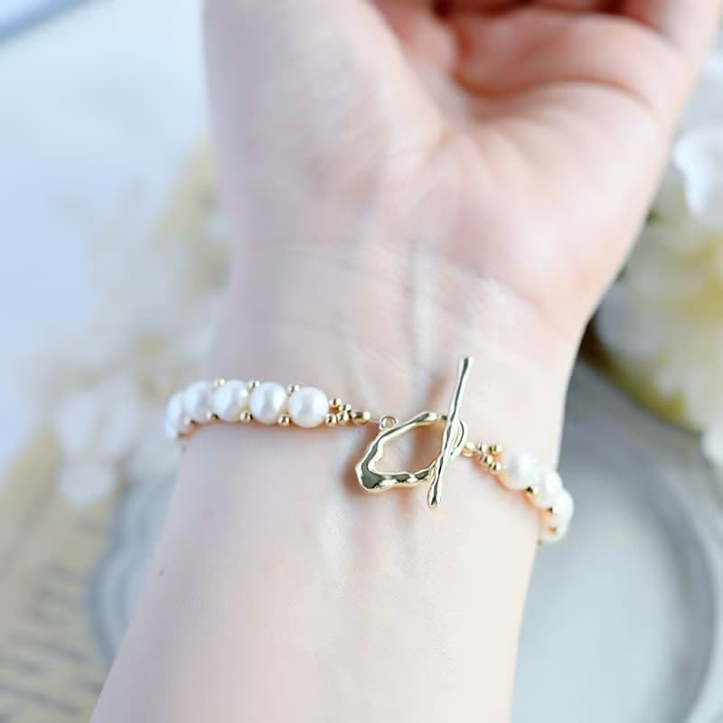 成功へと導いてくれる　キスミー　サンストーンとバロックパールの手編みブレスレット 5月/6月誕生石