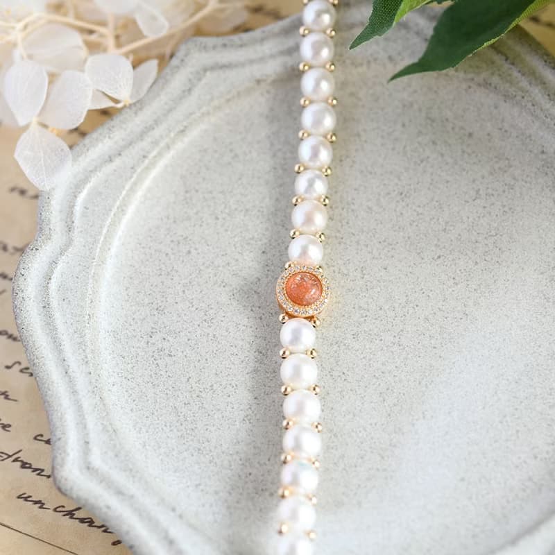 成功へと導いてくれる　キスミー　サンストーンとバロックパールの手編みブレスレット 5月/6月誕生石