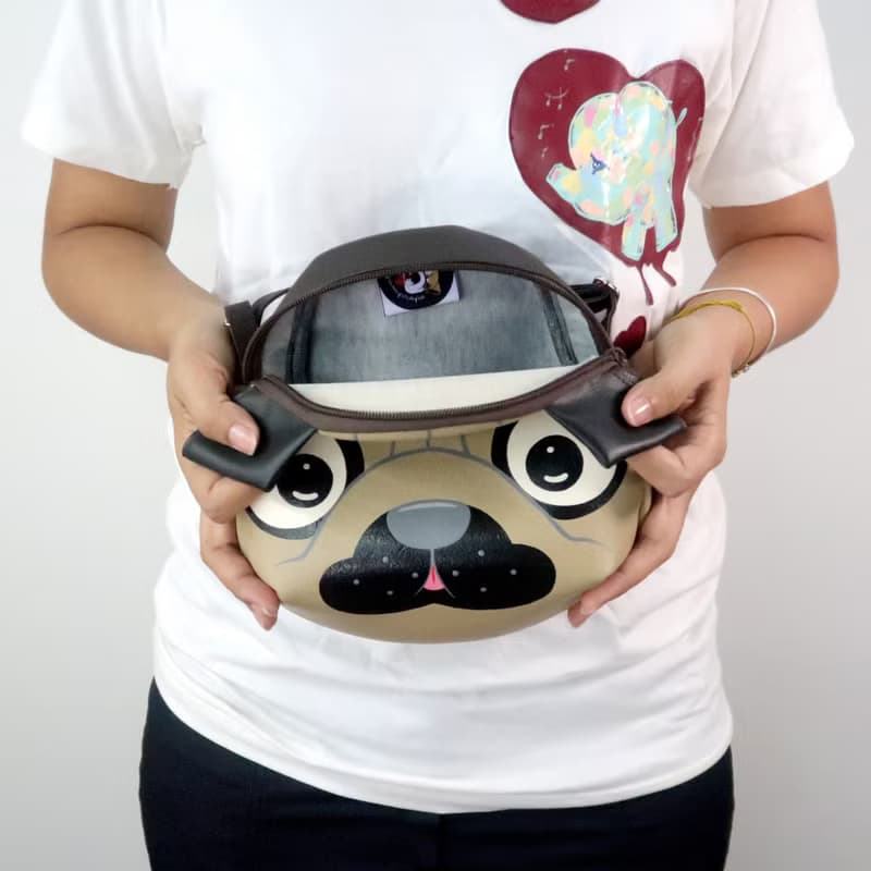 Pug crossbody bag is compact fro carrying mobile phones and other essentials.
