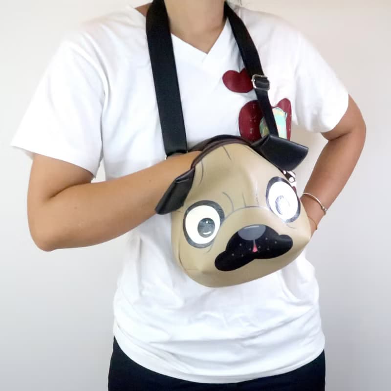 Pug crossbody bag is compact fro carrying mobile phones and other essentials.