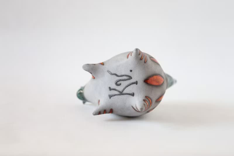 Handmade Ceramic Cat with Fish – Modern Animal Sculpture with Orange Stripes