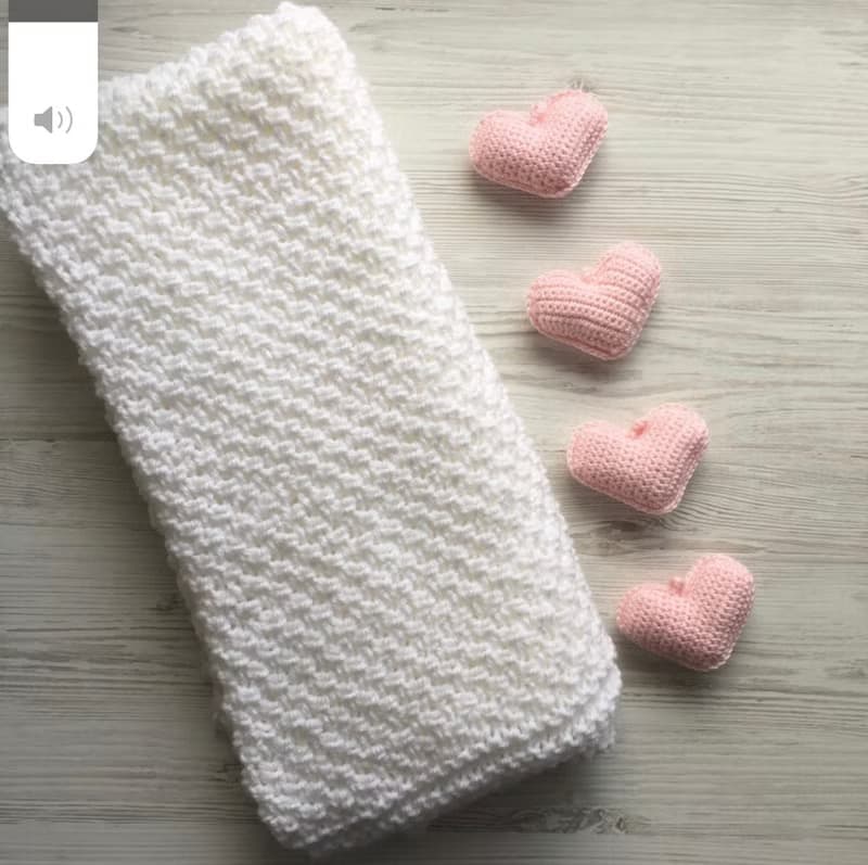 Hand knit white blanket with blue, or pink hearts toys for baby. Baptism blanket