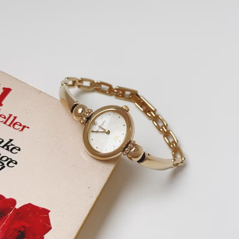 Courreges Gold Tone Bangle Style Bracelet Watch