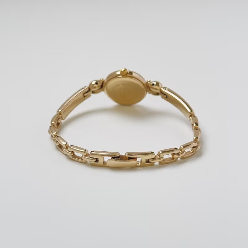 Courreges Gold Tone Bangle Style Bracelet Watch