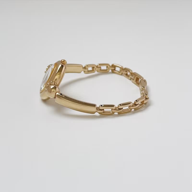 Courreges Gold Tone Bangle Style Bracelet Watch