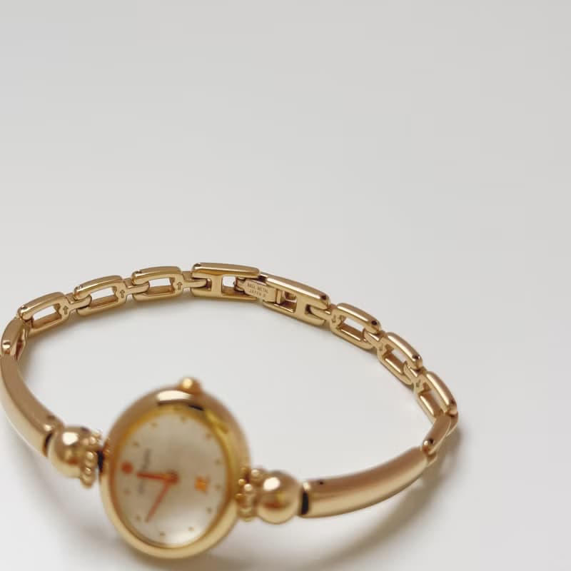 Courreges Gold Tone Bangle Style Bracelet Watch