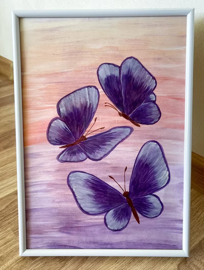 Purple butterflies on a lilac-peach background. Watercolor.