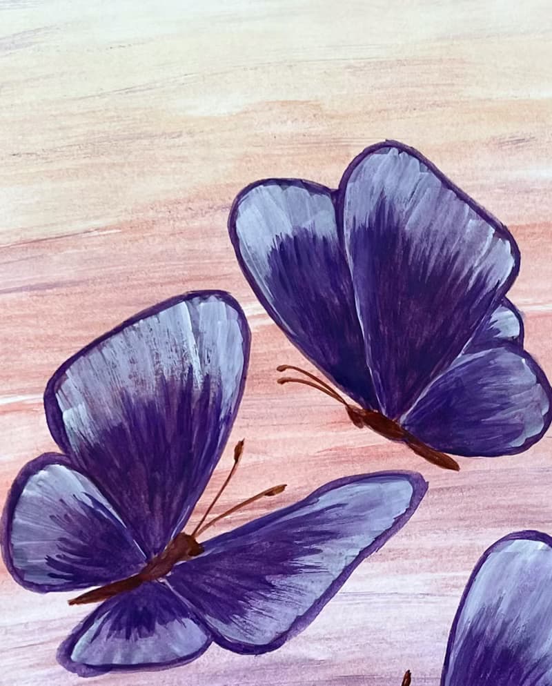 Purple butterflies on a lilac-peach background. Watercolor.