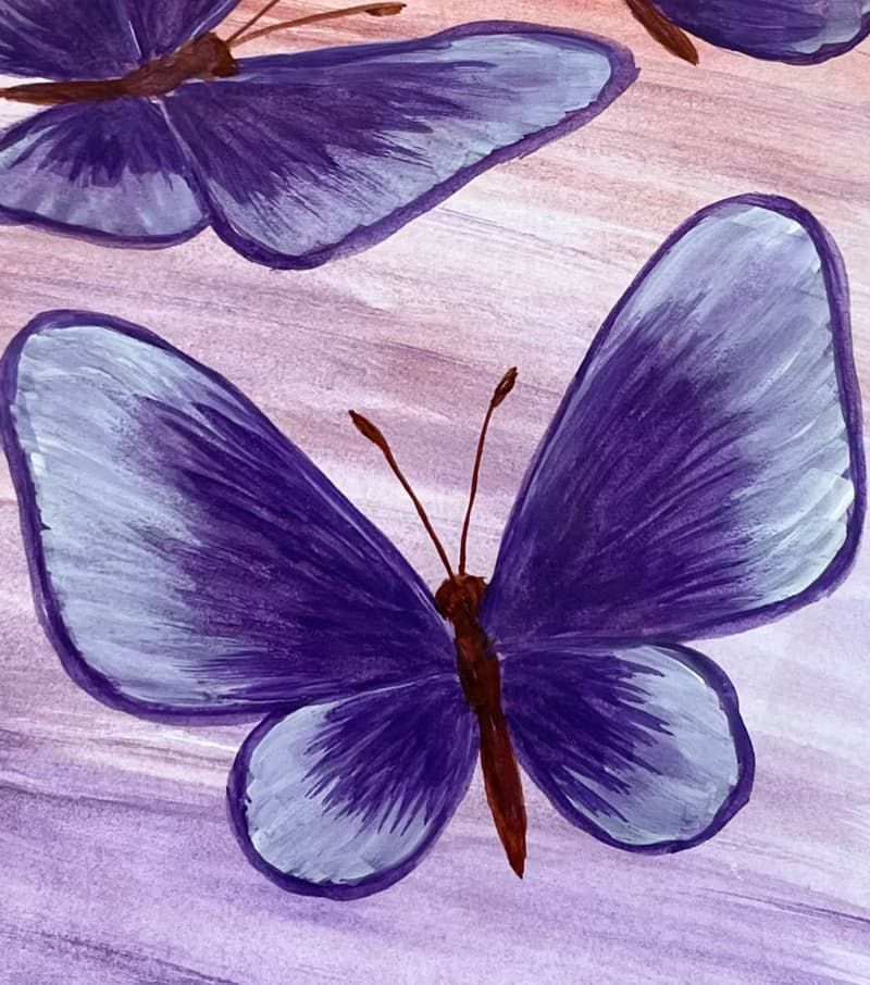 Purple butterflies on a lilac-peach background. Watercolor.