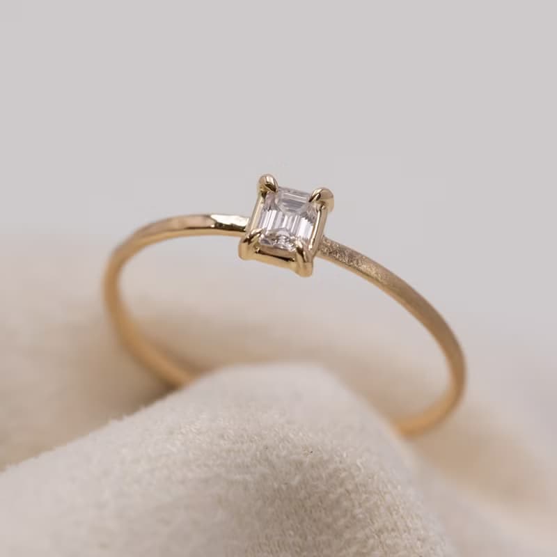 Emerald cut diamond harmony ring