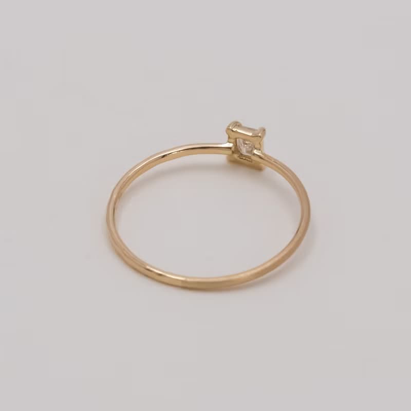 Emerald cut diamond harmony ring