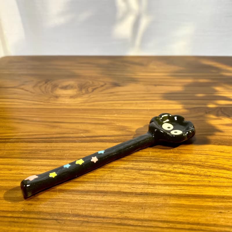 Handmade ceramic spoon with black dust from Totoro.