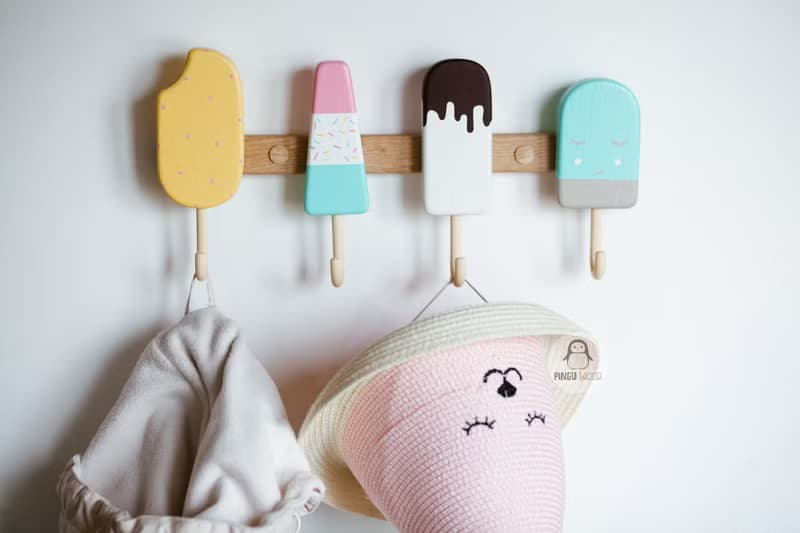 Clothes and towel hanger for nursery with wooden ice cream hooks