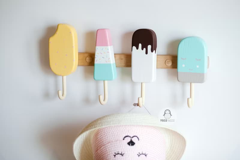 Clothes and towel hanger for nursery with wooden ice cream hooks