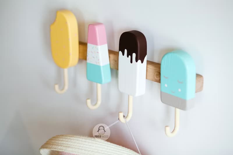Clothes and towel hanger for nursery with wooden ice cream hooks