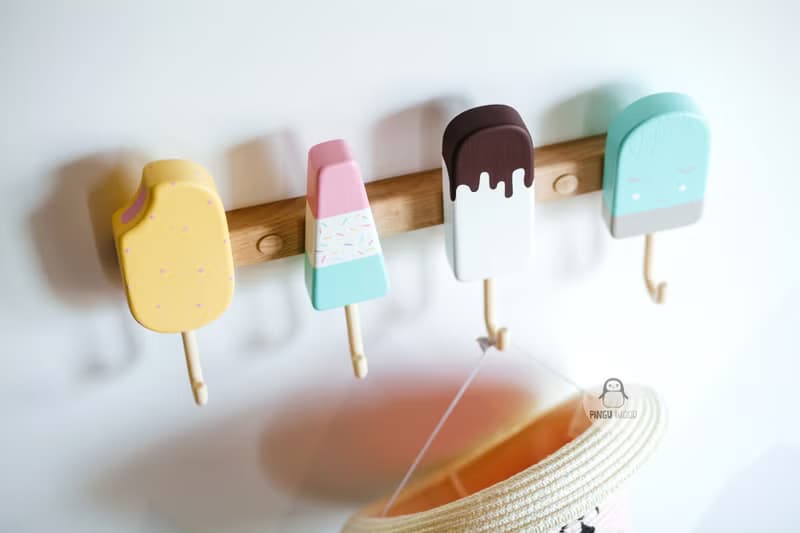 Clothes and towel hanger for nursery with wooden ice cream hooks