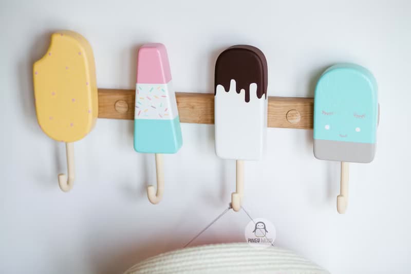 Clothes and towel hanger for nursery with wooden ice cream hooks