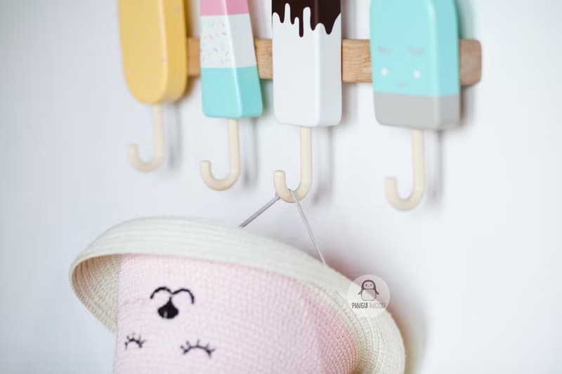 Clothes and towel hanger for nursery with wooden ice cream hooks